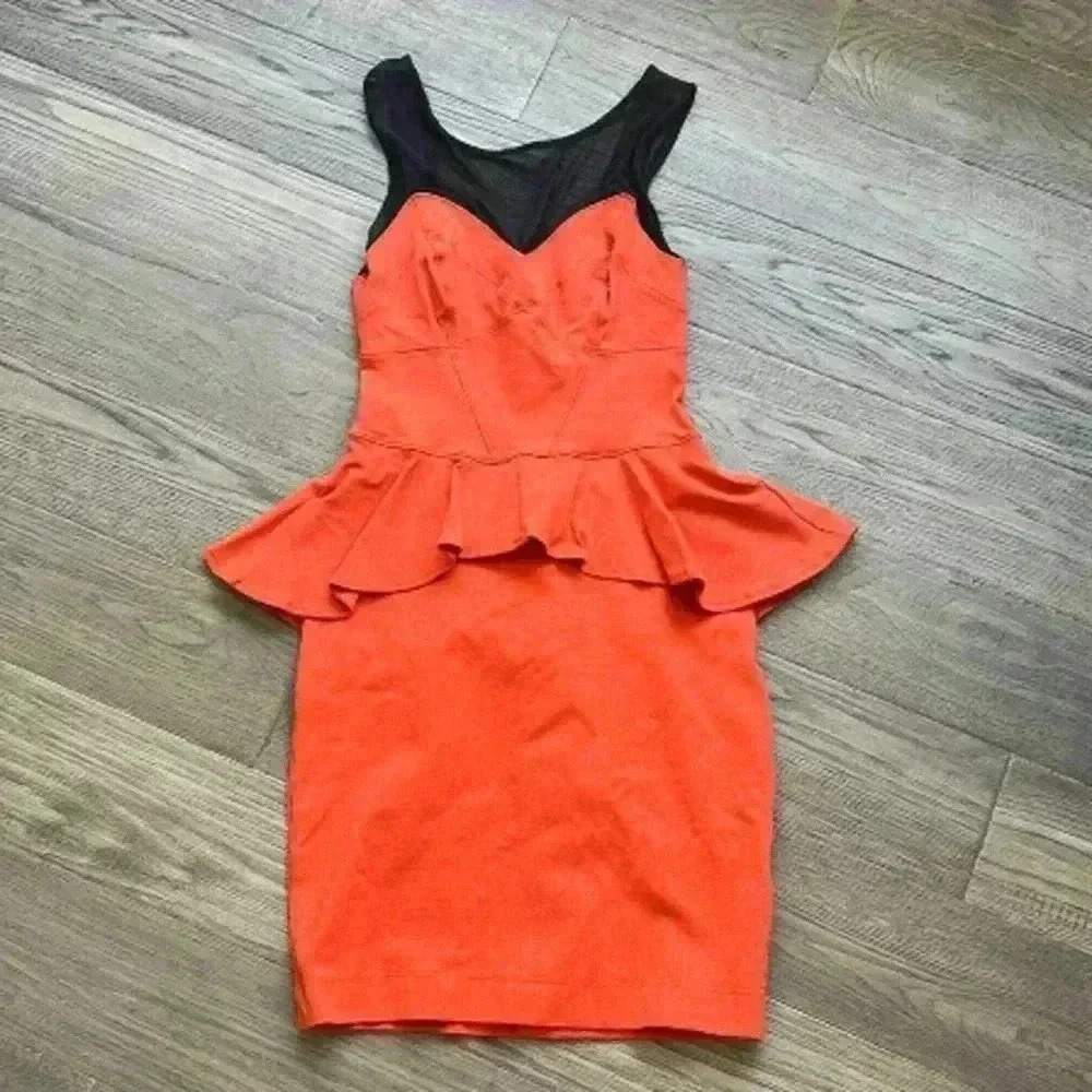 Bebe | Orange/red and black peplum dress